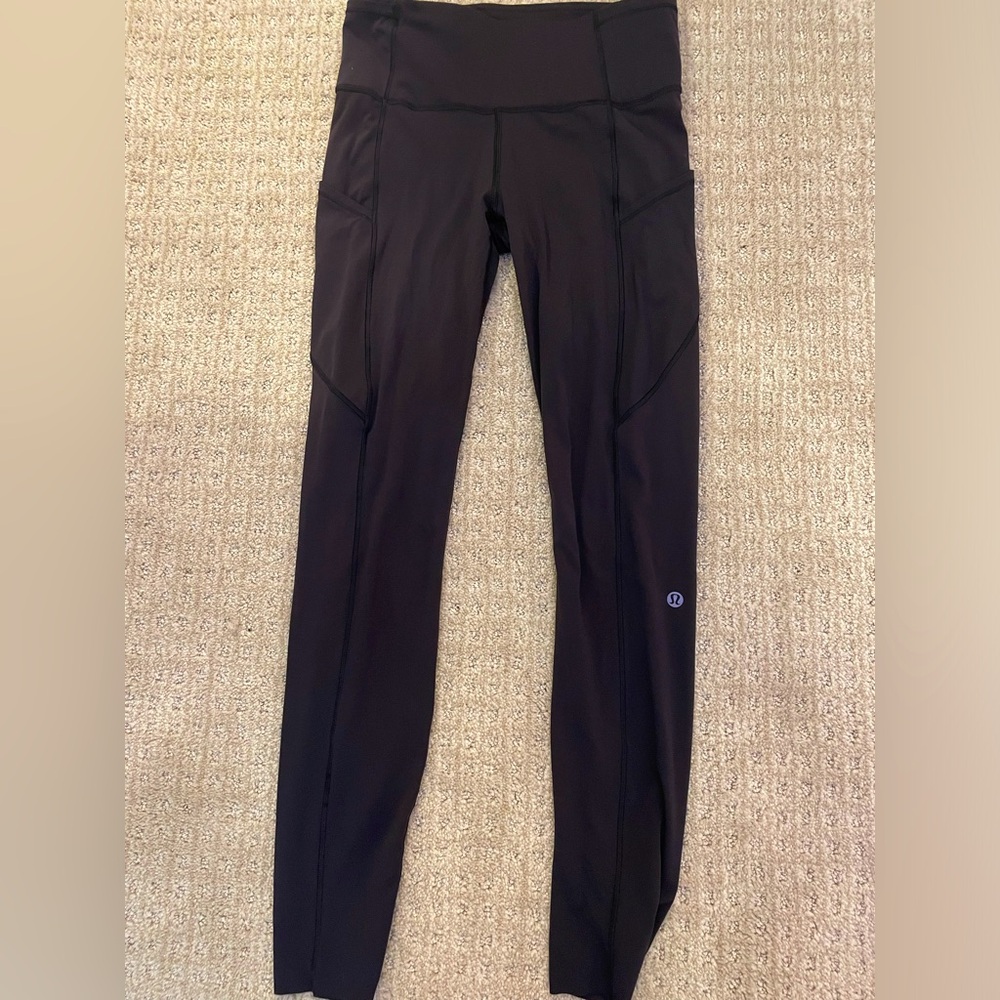 Black Lululemon Wunder Train High-Rise with Pockets 25”